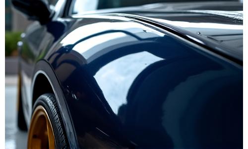 Close-up of a meticulously detailed car's paintwork reflecting light